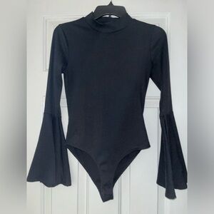 Altar’d State black mock neck body suit with bell sleeves. Size small